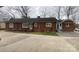 Brick home with a large driveway and backyard at 936 N 5Th St, Albemarle, NC 28001