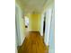 Light and airy hallway with hardwood floors at 936 N 5Th St, Albemarle, NC 28001