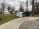 View of a backyard with a covered storage area at 936 N 5Th St, Albemarle, NC 28001