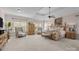 Spacious main bedroom with carpeted floors and large windows at 10418 Annie Oakley Ln, Charlotte, NC 28227