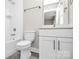 Bathroom with a tub, toilet and vanity at 1420 W 4Th St, Charlotte, NC 28208
