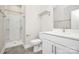 Modern bathroom with white vanity, shower, and toilet at 1420 W 4Th St, Charlotte, NC 28208