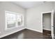 Spacious bedroom with dark hardwood floors and access to a closet at 1420 W 4Th St, Charlotte, NC 28208
