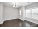 Spacious dining area with hardwood floors and chandelier at 1420 W 4Th St, Charlotte, NC 28208