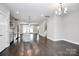 Open concept dining area with dark hardwood floors and chandelier at 1420 W 4Th St, Charlotte, NC 28208