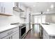 Modern kitchen with stainless steel appliances and gray cabinets at 1420 W 4Th St, Charlotte, NC 28208