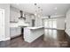 Modern kitchen with island, stainless steel appliances, and gray cabinets at 1420 W 4Th St, Charlotte, NC 28208