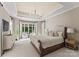 Luxurious main bedroom with a sitting area and water views at 148 Lightship Dr, Mooresville, NC 28117