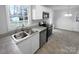 Updated kitchen with stainless steel sink and appliances at 220 Salem Ave, Dallas, NC 28034