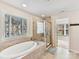 Bathroom with soaking tub, shower, and double vanity at 250 Kenway Loop, Mooresville, NC 28117