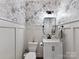 Stylish powder room with modern vanity and patterned wallpaper at 250 Kenway Loop, Mooresville, NC 28117