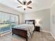 Bright bedroom with wood flooring and large window with blinds at 250 Kenway Loop, Mooresville, NC 28117