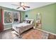 Light and bright bedroom with large window and wood floor at 250 Kenway Loop, Mooresville, NC 28117