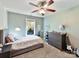 Bedroom with single bed, dresser, and view of the backyard at 250 Kenway Loop, Mooresville, NC 28117