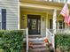 Welcoming front porch with brick steps and seasonal decor at 250 Kenway Loop, Mooresville, NC 28117