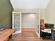 Home office with wood desk and access to additional storage at 250 Kenway Loop, Mooresville, NC 28117