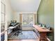 Home office with wood desk, large window, and workspace at 250 Kenway Loop, Mooresville, NC 28117