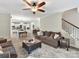 Open living room with hardwood floors and view into kitchen and dining areas at 250 Kenway Loop, Mooresville, NC 28117