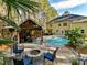 Backyard oasis with pool, patio, pergola, and fire pit at 250 Kenway Loop, Mooresville, NC 28117