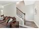 Elegant staircase with wrought iron railing at 250 Kenway Loop, Mooresville, NC 28117