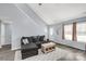 Living area with gray sectional sofa, coffee table, and natural light at 4238 Cornelia Ln, Rock Hill, SC 29732