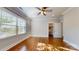 Well-lit bedroom with hardwood floors and window coverings at 8919 Clavemorr Glenn Ct, Charlotte, NC 28226