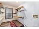 Laundry room with wooden shelves and a folding counter at 190 Heathergate Ln, Stanley, NC 28164