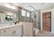 Bathroom with a walk-in shower and double vanity at 5124 Heathland Dr # 78, Charlotte, NC 28215