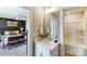 Bathroom with vanity, tub and view of bedroom at 5124 Heathland Dr # 78, Charlotte, NC 28215