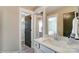 Simple bathroom with vanity, and access to closet at 5124 Heathland Dr # 78, Charlotte, NC 28215