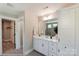 Modern bathroom with white vanity, hexagon tile floor, and walk-in shower at 5124 Heathland Dr # 78, Charlotte, NC 28215