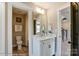 Clean bathroom with toilet, vanity, and shower/tub combo at 5124 Heathland Dr # 78, Charlotte, NC 28215