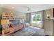 Bright bedroom with bunk beds, large window, and stylish decor at 5124 Heathland Dr # 78, Charlotte, NC 28215