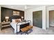Bedroom with dark green doors and metal bed frame at 5124 Heathland Dr # 78, Charlotte, NC 28215