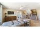 Bonus room with sectional sofa and access to a bathroom at 5124 Heathland Dr # 78, Charlotte, NC 28215