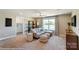 Bonus room with sectional sofa and built-in shelving at 5124 Heathland Dr # 78, Charlotte, NC 28215