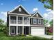 Two-story house with gray siding, white trim, and a two-car garage at 5124 Heathland Dr # 78, Charlotte, NC 28215