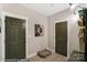 Hallway with two doors and pet bed at 5124 Heathland Dr # 78, Charlotte, NC 28215