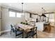 Eat-in kitchen with wood table, white cabinets, and stainless steel appliances at 5124 Heathland Dr # 78, Charlotte, NC 28215