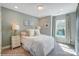 Well-lit bedroom with a comfortable bed and elegant decor at 5552 Stafford Rd # 28, Charlotte, NC 28215