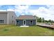 Newly built home with a small backyard and patio at 1052 Horizon Ln, Chester, SC 29706