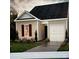 Charming one-story house with a gray exterior, attached garage, and landscaped lawn at 1052 Horizon Ln, Chester, SC 29706