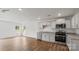 Modern kitchen with light gray cabinets, stainless steel appliances, and hardwood floors at 1052 Horizon Ln, Chester, SC 29706