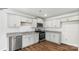 Modern kitchen with light gray cabinets, stainless steel appliances, and hardwood floors at 1052 Horizon Ln, Chester, SC 29706