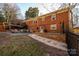 Brick patio with seating area and fire pit adjacent to home at 132 30Th Nw Ave, Hickory, NC 28601