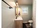 Modern bathroom with double vanity and hexagon tile floor at 132 30Th Nw Ave, Hickory, NC 28601