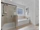 Bathroom with soaking tub and walk-in shower at 15710 Laurel Oak Cres, Davidson, NC 28036