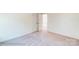 Spacious bedroom with neutral carpeting and access to another room at 2024 Embassy Ct # 49, Charlotte, NC 28213