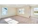 Bright bedroom with neutral carpeting and window at 2024 Embassy Ct # 49, Charlotte, NC 28213