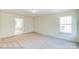 Bright bedroom with window and bathroom view at 2024 Embassy Ct # 49, Charlotte, NC 28213